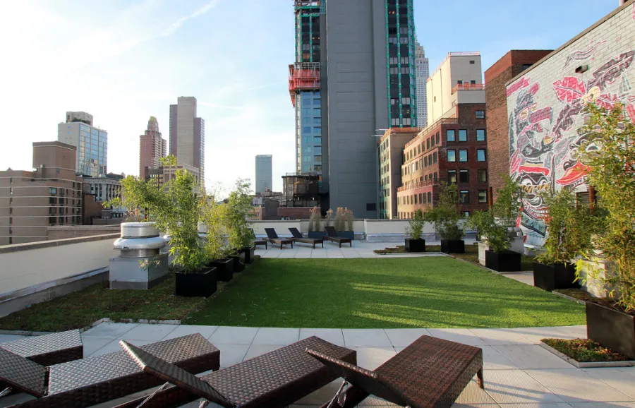 Rooftop deck with artificial grass and city views